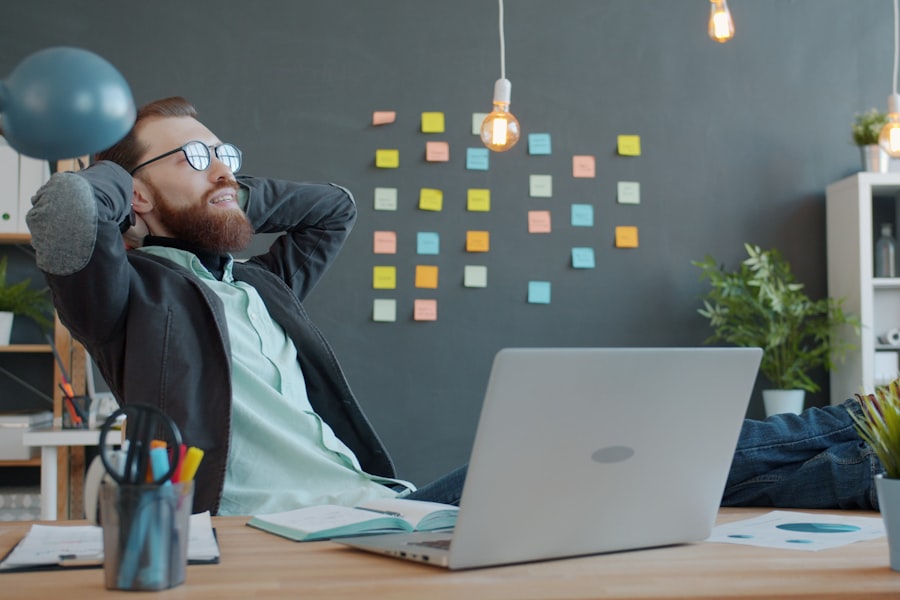 A desk worker easing a stiff neck at a laptop