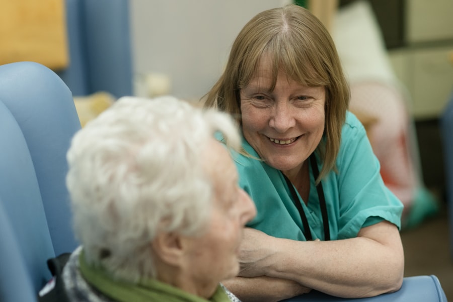A carer supporting an older woman at home