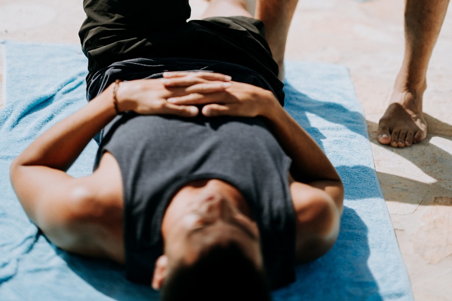A physiotherapist treating a patient lying on a mat